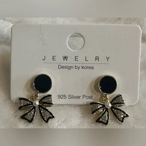 Bow earrings with pearl accents. - New in package